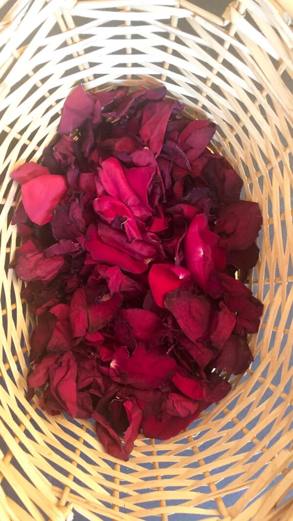 red dried rose petals in a wheat colored basket